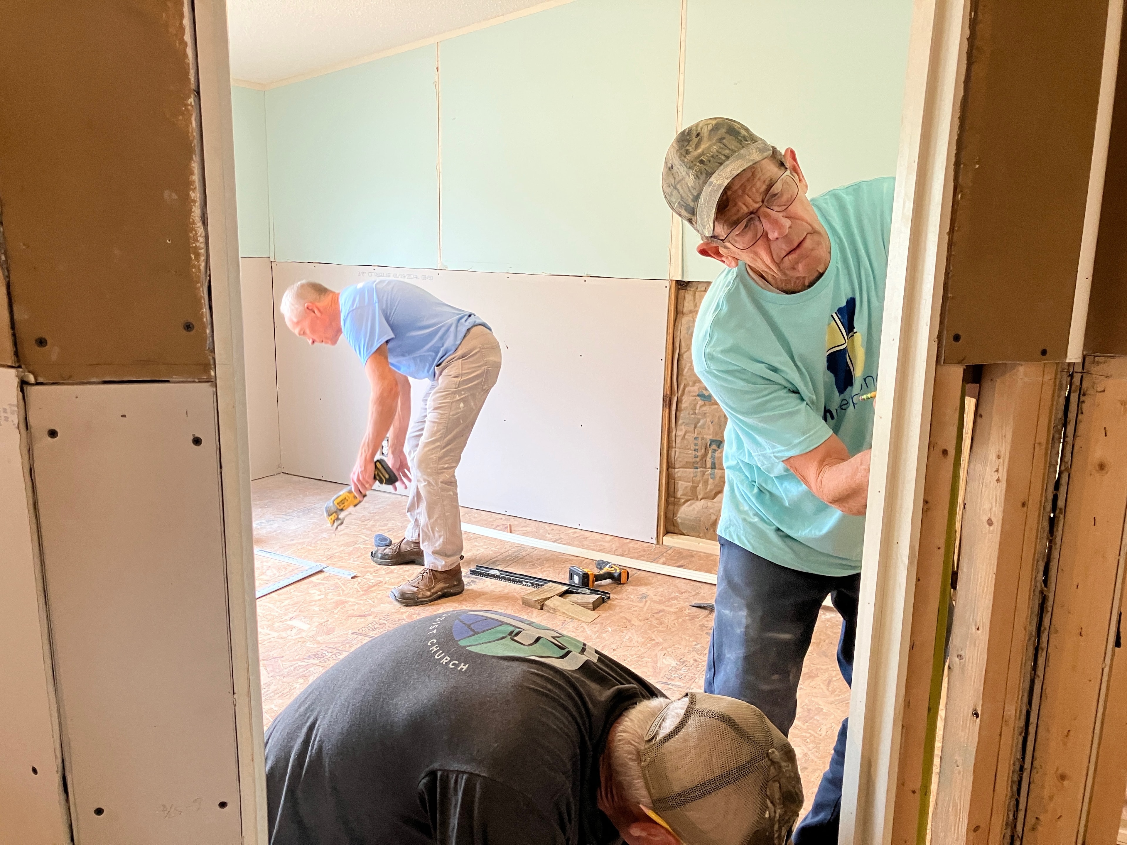 Faith Responders volunteers working together on home reconstruction